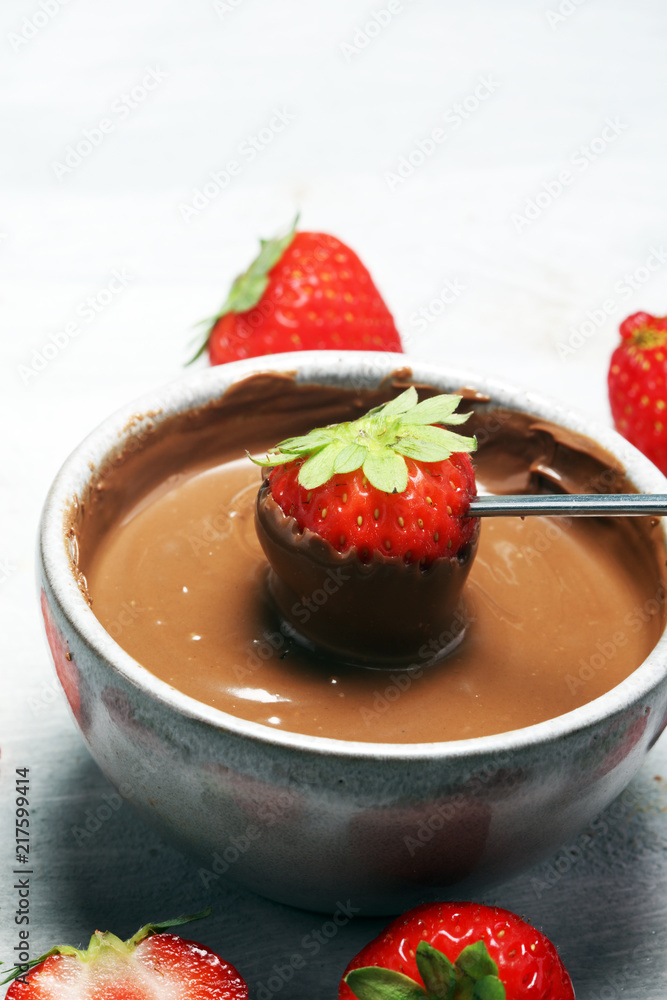 Fondue with Melting chocolate or melted chocolate and strawberry. Fondue with Melting chocolate or melted chocolate and strawberry.