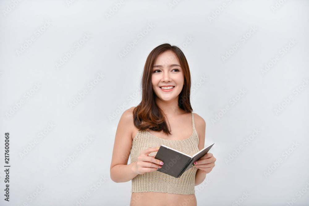 Learning concept. Beautiful girl is reading a book with happiness. Learning concept. Beautiful girl is reading a book with happiness.