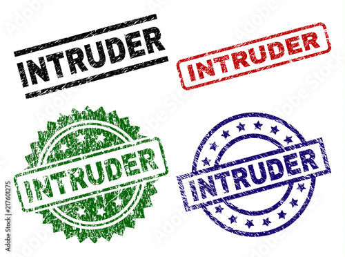 INTRUDER seal prints with damaged surface. Black, green,red,blue vector rubber prints of INTRUDER title with retro surface. Rubber seals with circle, rectangle, rosette shapes.