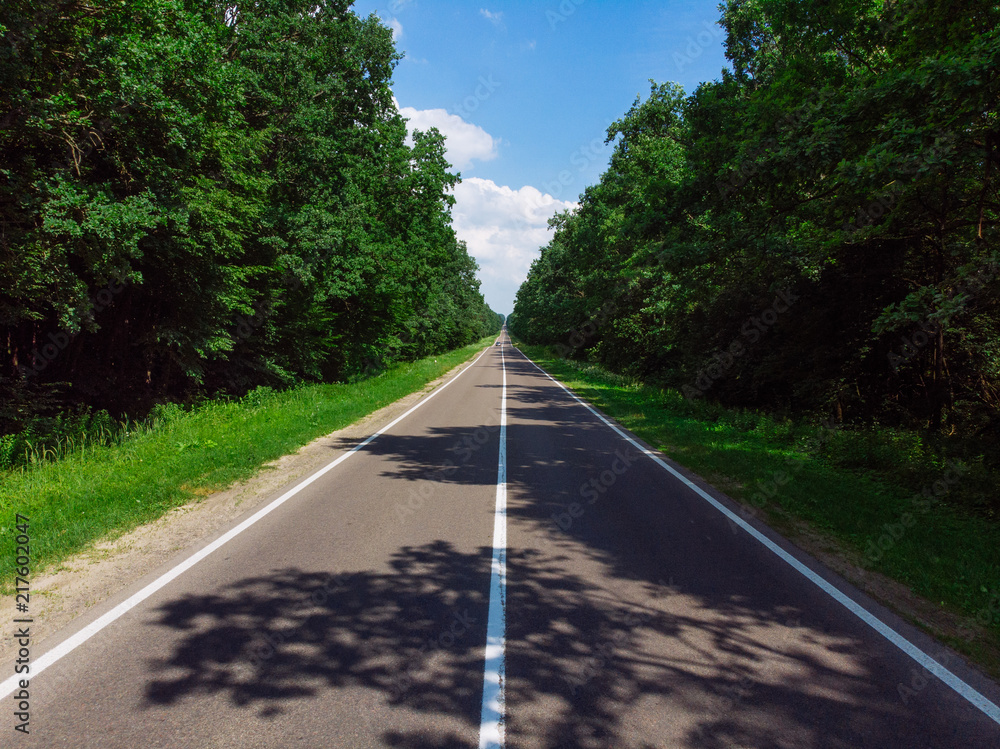 view of straight highway. sunny day. car travel concept view of straight highway. sunny day. car travel concept