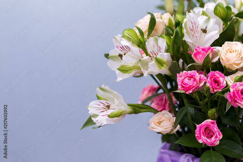 Closeup beautiful flowers in pastel colors on a blue background. Greeting card, Mom's day, wedding invitation, birthday .Copy space. Closeup beautiful flowers in pastel colors on a blue background. Greeting card, Mom's day, wedding invitation, birthday .Copy space.