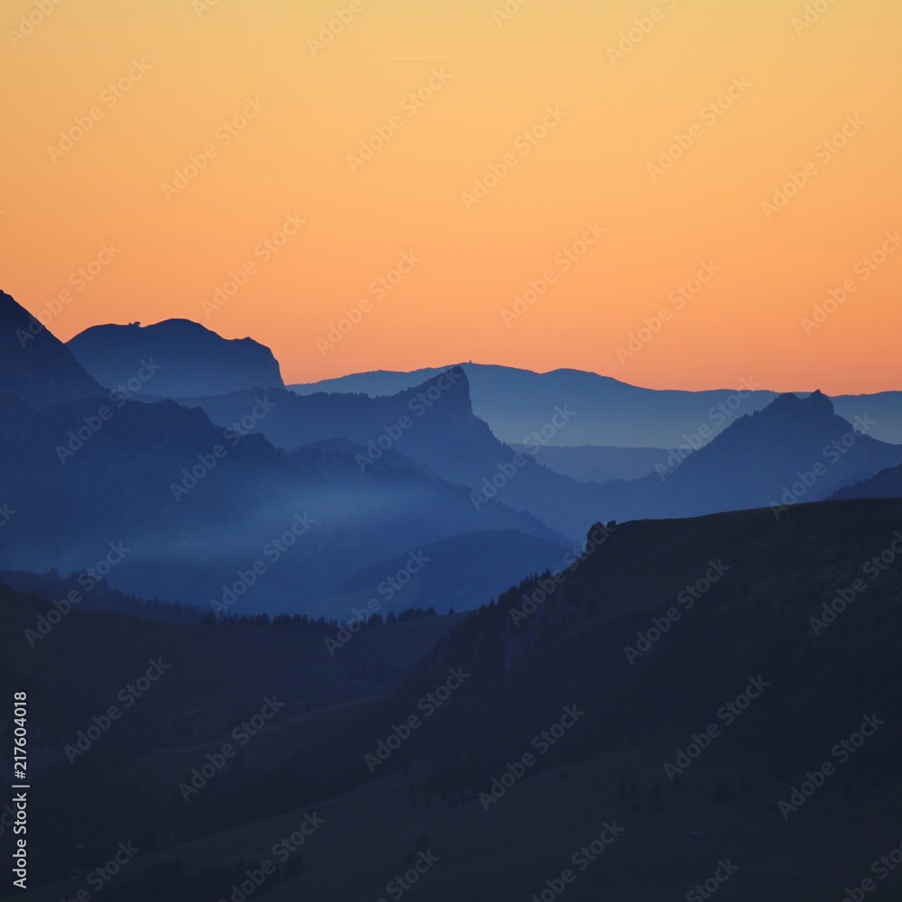 Outlines of Mount Wiriehore and other mountains in the Bernese Oberland. Sunset seen from Mount Niesen.
