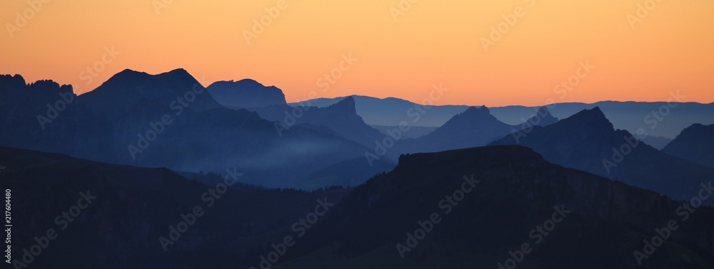 Mountain ranges at sunset. View from Mount Niesen. - obrazy, fototapety, plakaty 