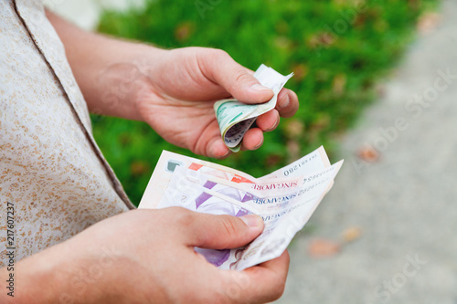 Photography Man holding singapore dollars in hands