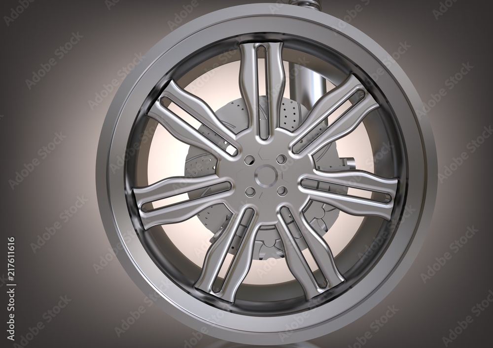 Obraz premium The silver wheel and the brake disc on a gray