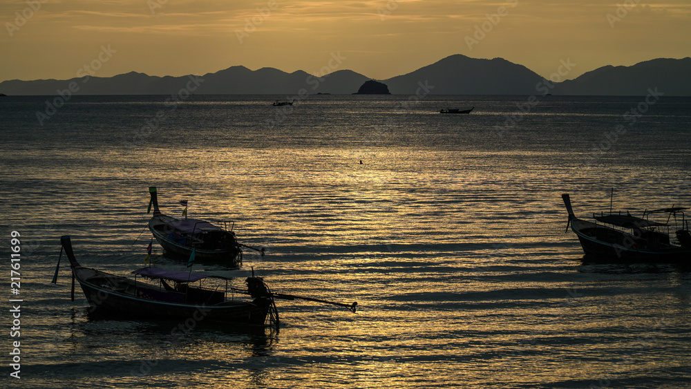 Thai fisherman village boats at sunset