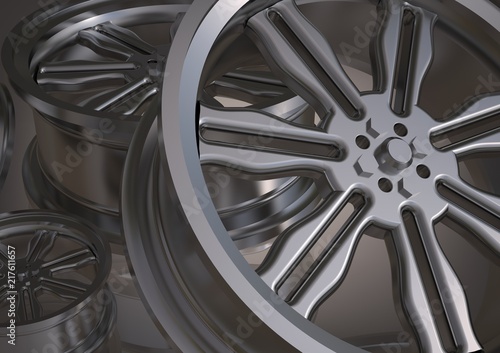 Silvery car wheels on a gray