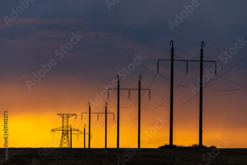Obraz na płótnie Rural landscape with high-voltage line on sunset w salonie