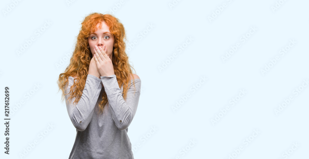 Young redhead woman shocked covering mouth with hands for mistake. Secret concept.