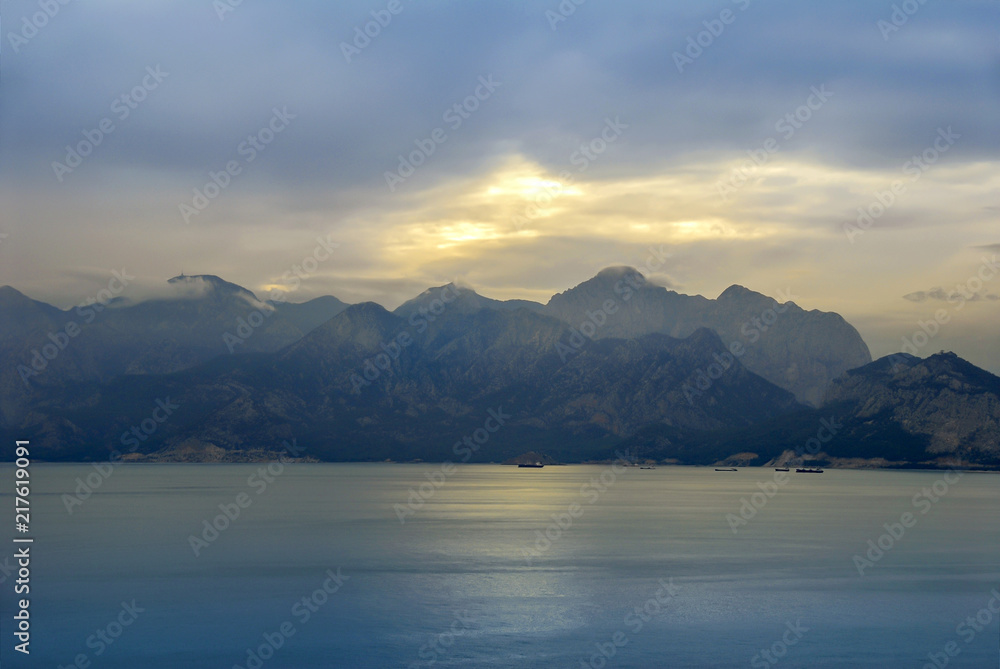 Antalya, Turkey, 19 December 2010: Gulf of Antalya with clouds and sunset Antalya, Turkey, 19 December 2010: Gulf of Antalya with clouds and sunset
