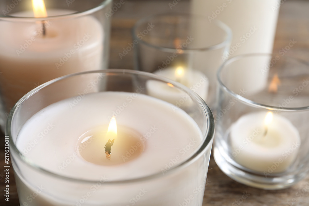 Burning wax candle in glass holder, closeup Burning wax candle in glass holder, closeup