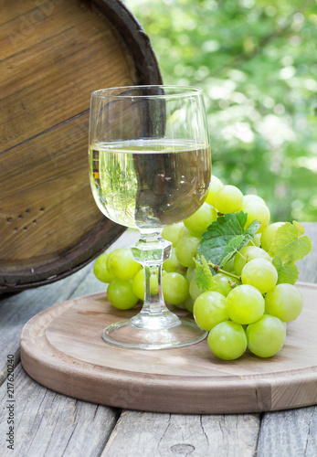 Outdoor Setting of a Glass of Wine and Green Grapes