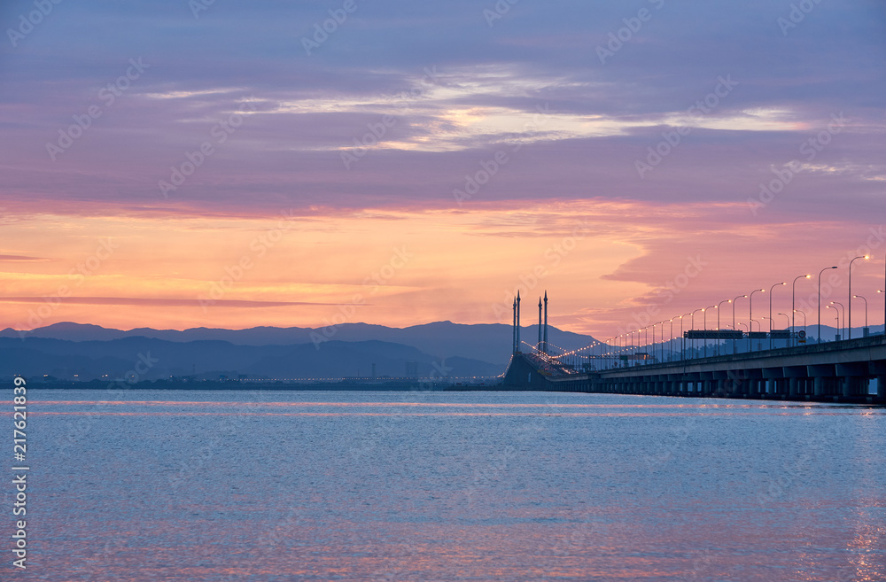 The Penang bridge against the background of colourful dawn The Penang bridge against the background of colourful dawn