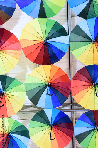 Rows of multicolored umbrellas creates a surreal abstract background