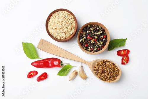 Fototapeta Naklejka Na Ścianę i Meble -  Composition with different aromatic spices on white background, top view