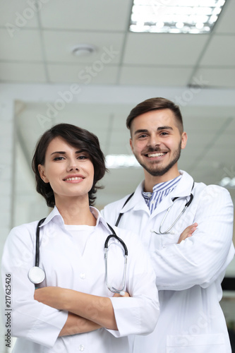 Portrait of doctors in coats at workplace