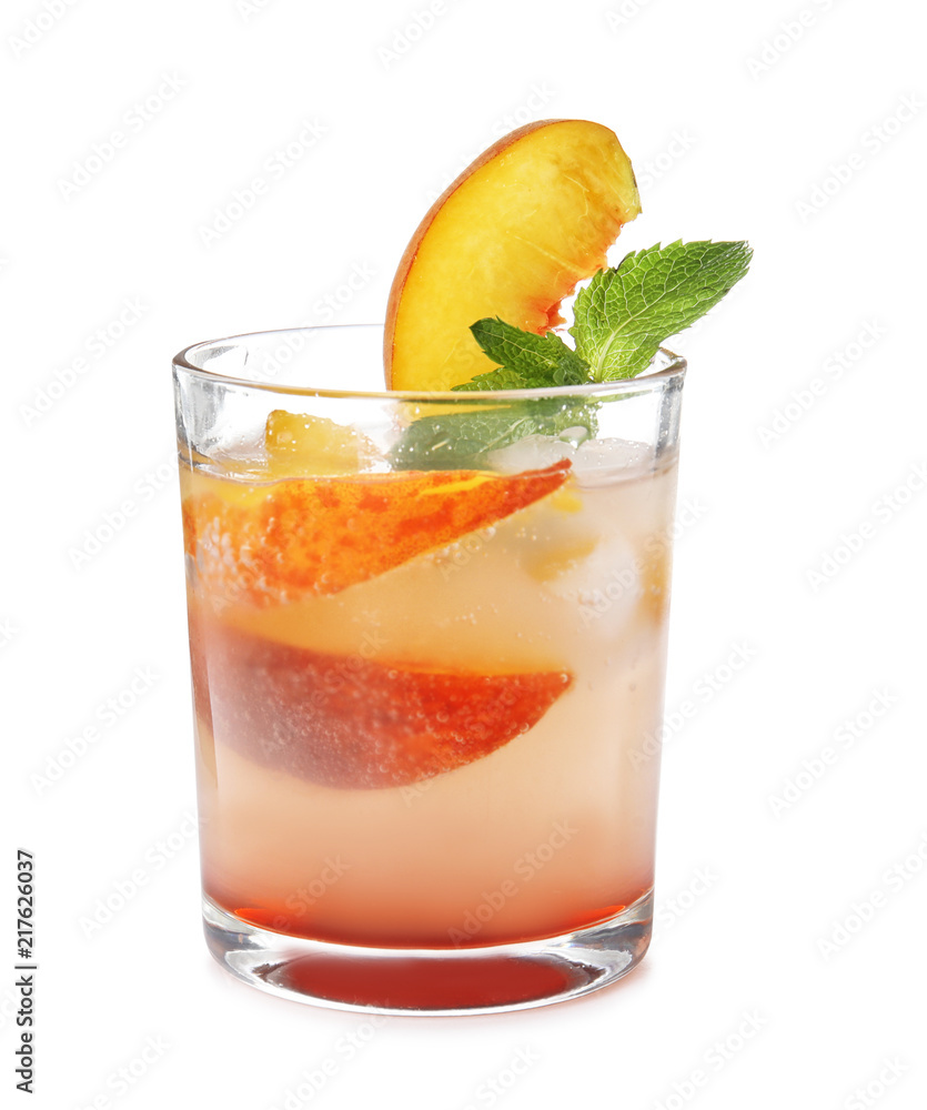 Peach cocktail in glass on white background. Refreshing drink Peach cocktail in glass on white background. Refreshing drink