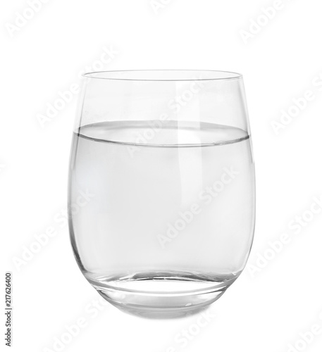 Glass of water with baking soda on white background