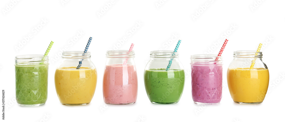 Jars with fresh tasty smoothies on white background Jars with fresh tasty smoothies on white background