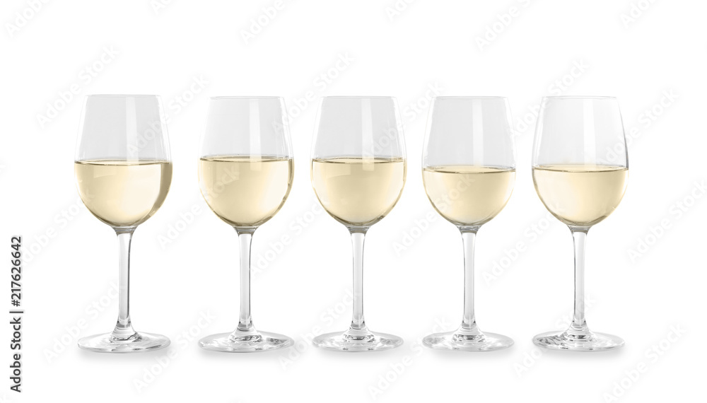 Glasses with white wine on light background Glasses with white wine on light background