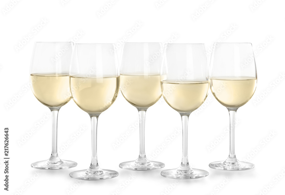 Glasses with white wine on light background Glasses with white wine on light background