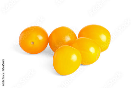 Tasty yellow cherry tomatoes on white background