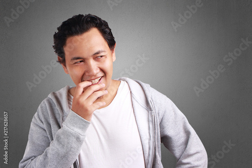 Young Man Thinking with a Smile Expression