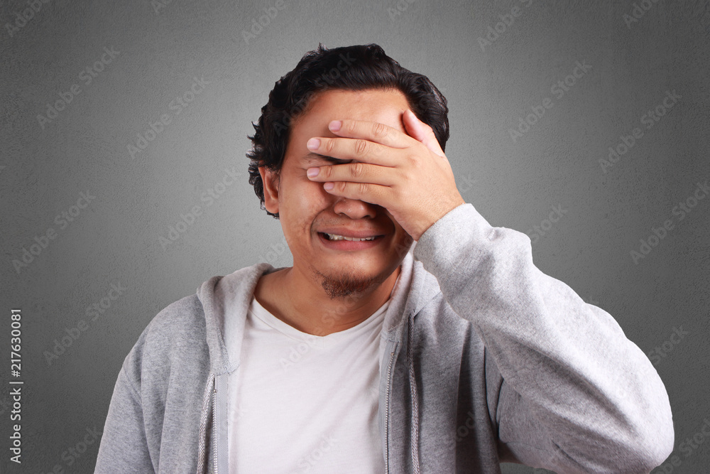 Young Man Cried, Covering Eyes with Hand Young Man Cried, Covering Eyes with Hand