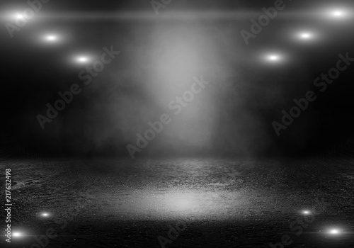 Background of an empty dark room. Empty walls, lights, smoke, glow, rays