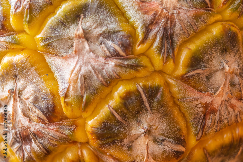Bright yellow Shell of a pineapple showing clear details and texture, geometric pattern, tropical fruit Bright yellow Shell of a pineapple showing clear details and texture, geometric pattern, tropical fruit