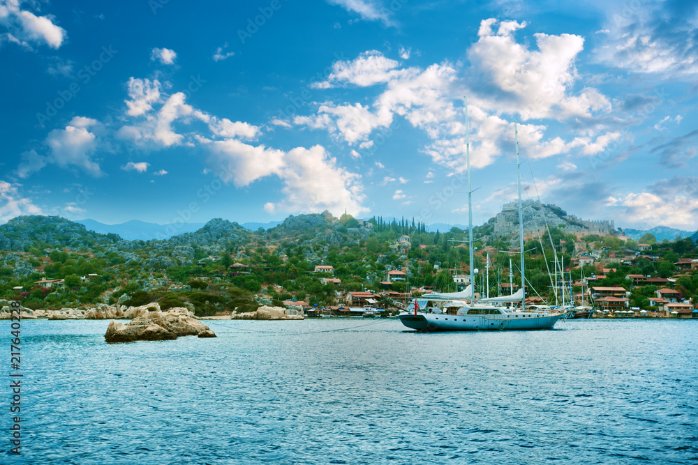 Beautiful scenery with sea and mountains, tourist boat. Fjord in Mediterranean Sea. 