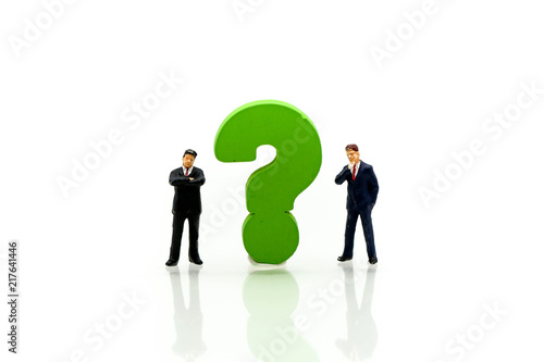 Miniature people : Businessman with THE QUESTION MARK using for concept Punctuation Day