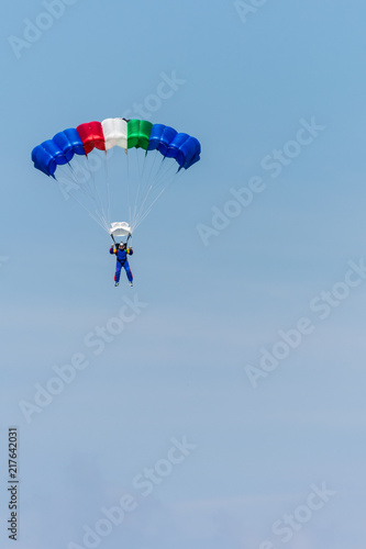 A Colourful Parachute Descending from the Sky at the Airshow