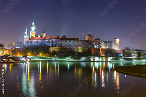 Wawel Castle in the evening in Krakow with reflection in the river, Poland. Long time exposure