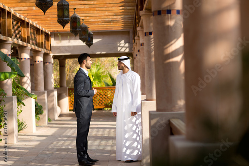 Businessmen talking outdoors. photo