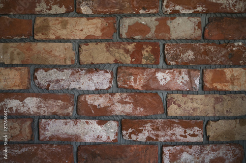 process of making old brick wall from cuts of vintage bricks
