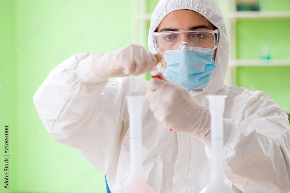 Chemist working in the lab on new experiment Chemist working in the lab on new experiment