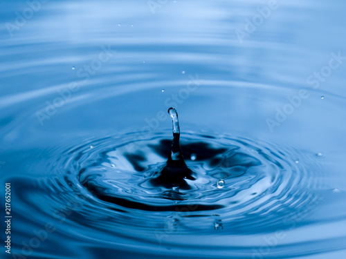 close up drop of water on blue background