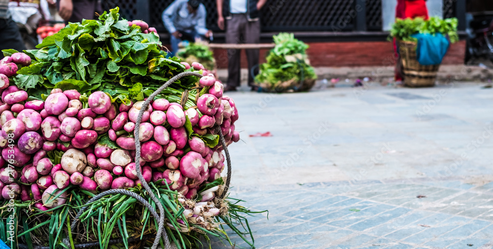 Basket with radish on the floor in the market