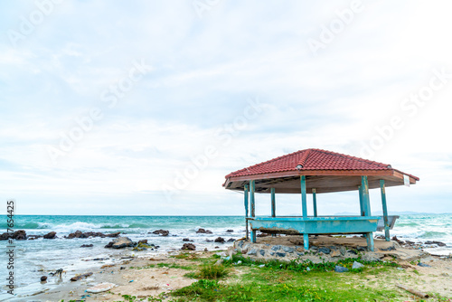 wood pavilion with beach and sea background