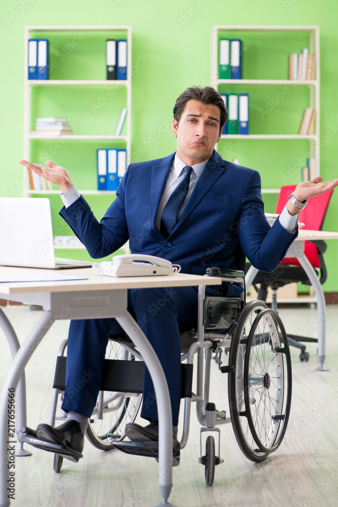 Disabled businessman working in the office Disabled businessman working in the office