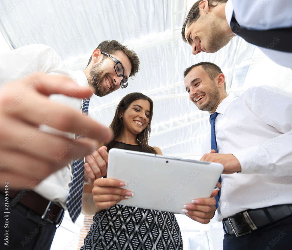 Fototapeta premium closeup of business team looking at digital tablet.
