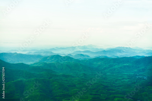 view of lush forest on the mountain and misty morning.