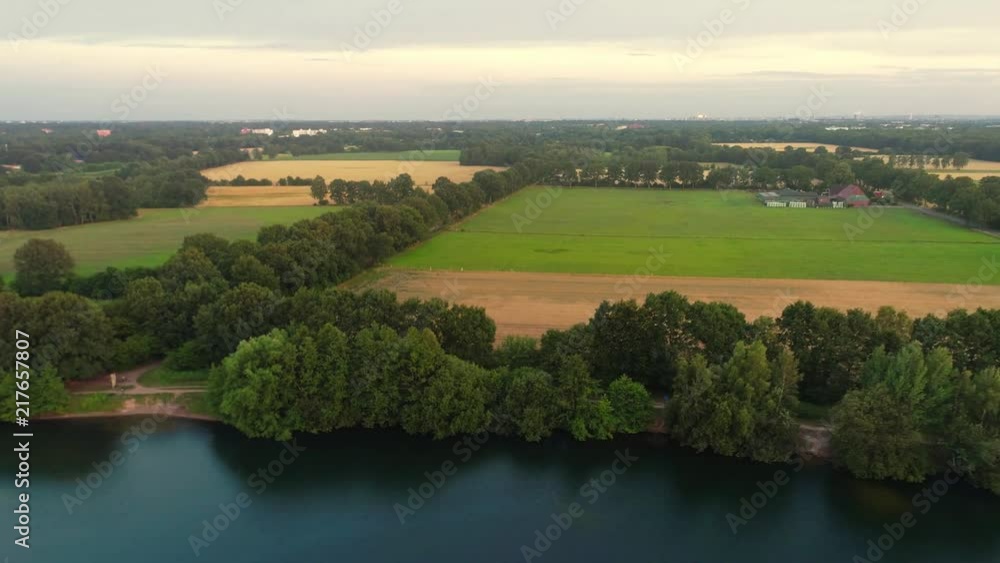 Aerial view of amazing sunset over the park in Germany. Hill and lake from birds eye view. Aerial view of amazing sunset over the park in Germany. Hill and lake from birds eye view.