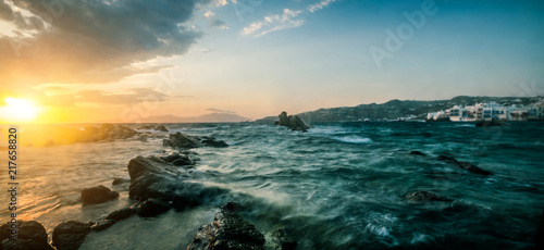 Beautiful seascape with rocks and waves at sunset