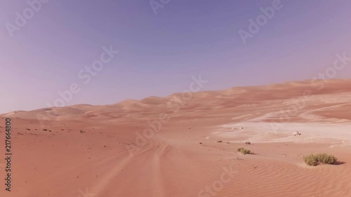 Traveling on an off-road car on the sand of Rub al Khali desert stock footage video photo