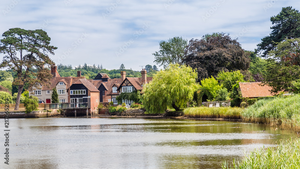 Obraz premium View on the beatiful historic Beaulieu village and river in the New forest area of Hampshire in England, United Kingdom