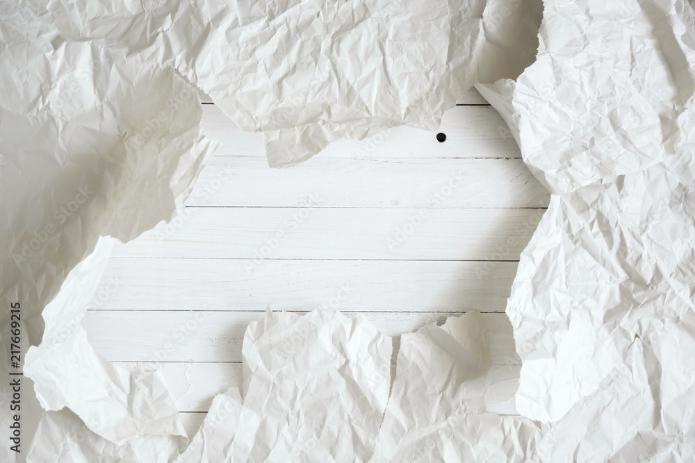 Obraz premium Texture white abstract background, crumpled white paper torn and white wooden board. Flat lay, top view, copy space 