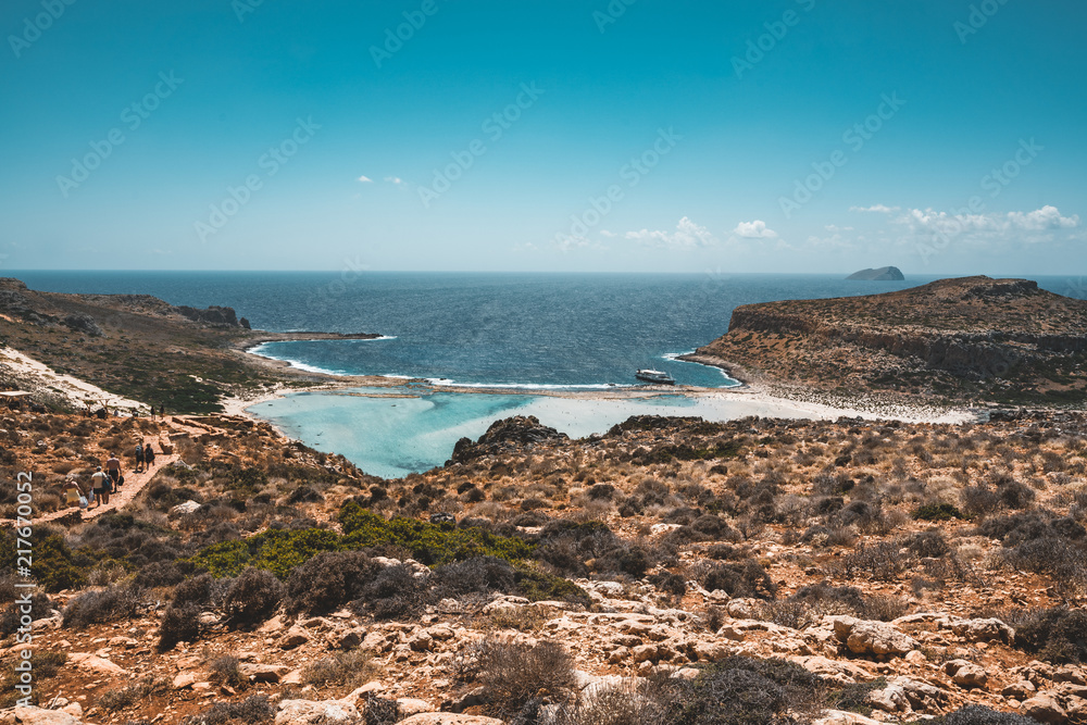View of the beautiful beach in Balos Lagoon, and Gramvousa island on Crete, Greece. Sunny day, blue Sky with clouds. View of the beautiful beach in Balos Lagoon, and Gramvousa island on Crete, Greece. Sunny day, blue Sky with clouds.