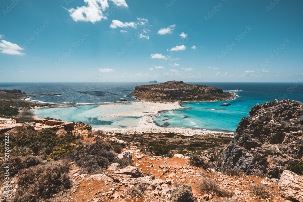View of the beautiful beach in Balos Lagoon, and Gramvousa island on Crete, Greece. Sunny day, blue Sky with clouds. View of the beautiful beach in Balos Lagoon, and Gramvousa island on Crete, Greece. Sunny day, blue Sky with clouds.